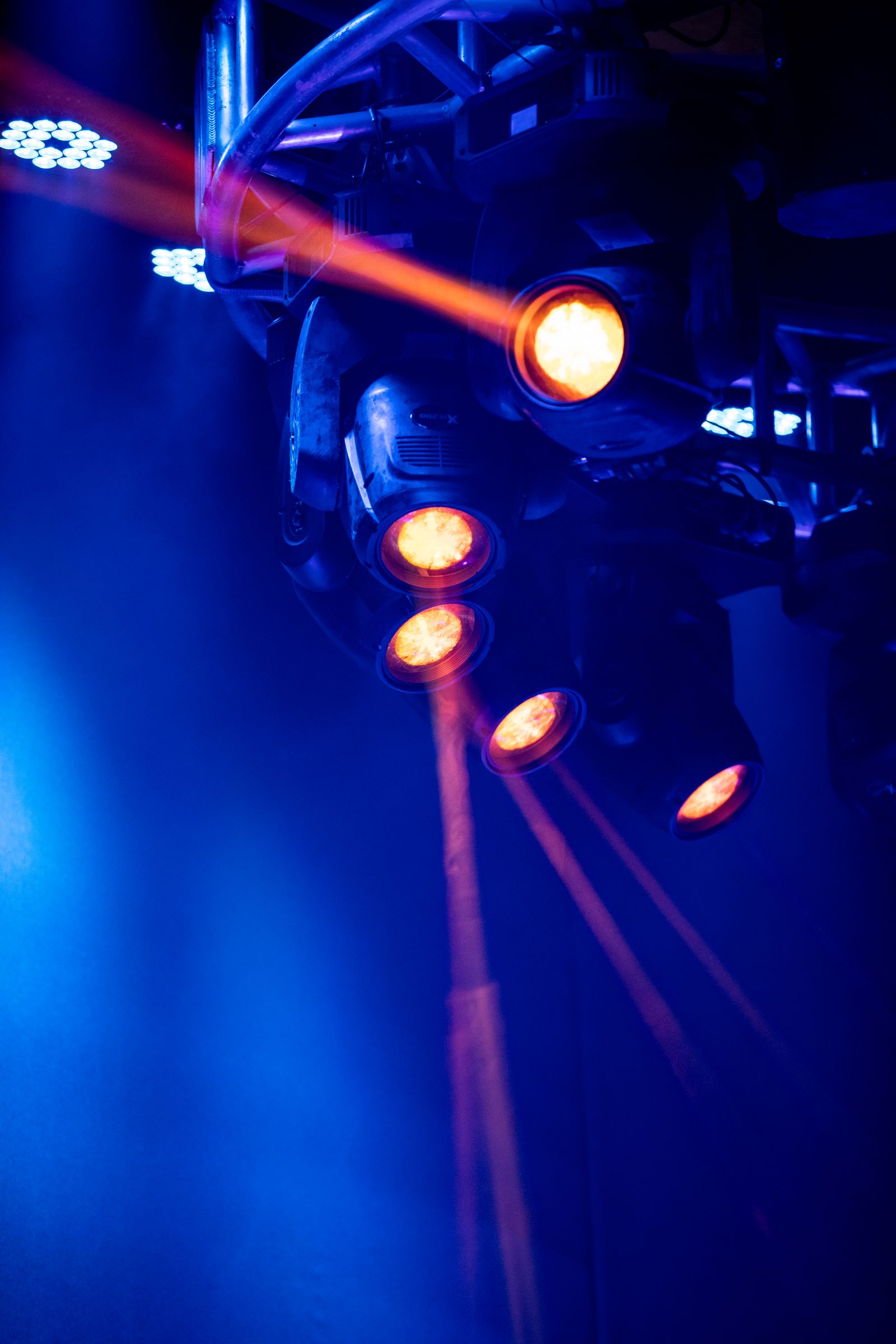 Professional lighting fixtures above a stage